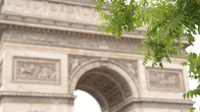 Arc de Triomphe Monument Framed by Green Leaves in Paris
