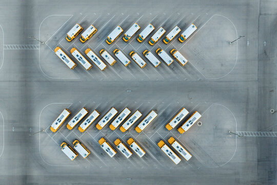 Aerial view of rows of yellow school buses parked in an organized lot in Las Vegas, Nevada, United States.