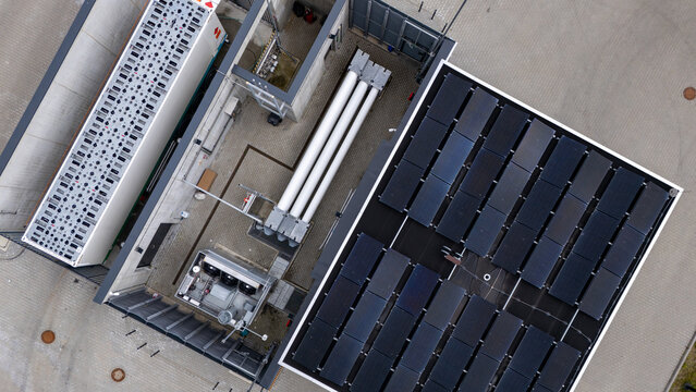 Aerial view of a modern hydrogen refueling station with integrated solar power: Green energy infrastructure for sustainable mobility and future technology.