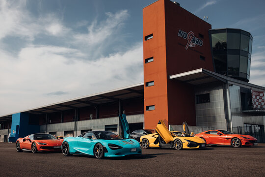 McLaren 720s, Lamborghini Revuelto, Ferrari 296 at the parking of raceway