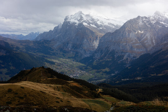 View of the Kleine Scheidegg mountain pass overlooking the Lauterbrunnen valley with snow-capped peaks and alpine meadows in Lauterbrunnen, Canton of Bern, Switzerland.