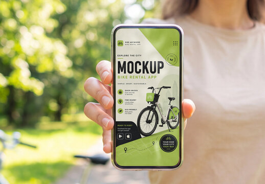 Person holding smartphone outdoors mockup