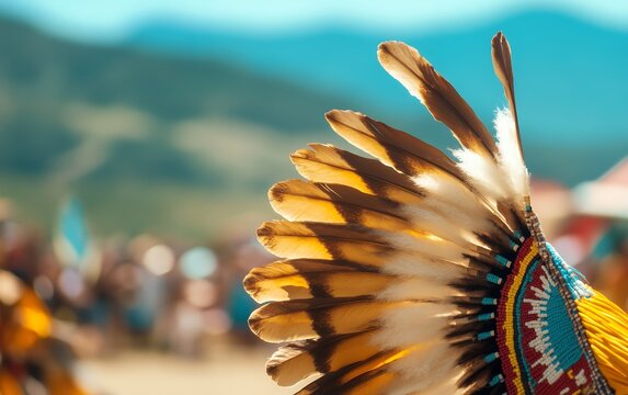 Close up of a traditional feather headdress with a blurred background, offering copy space for text