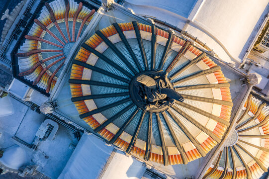 Aerial view of the intricate roof and dome of the Palacio de Bellas Artes featuring vibrant orange and yellow tiles in Ciudad de Mexico, Ciudad de Mexico, Mexico.