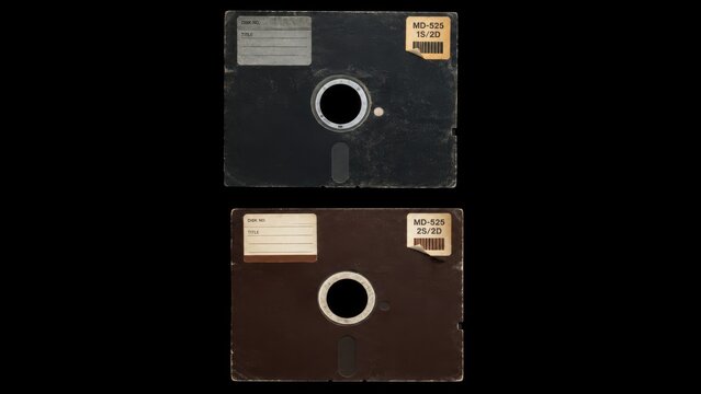 Two vintage floppy disks isolated on a black background
