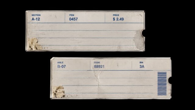 Two worn vintage shelf labels isolated on black background