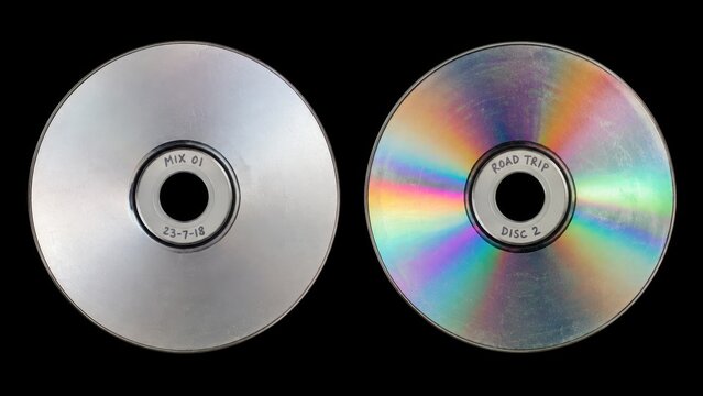 Two recordable compact discs isolated on black background