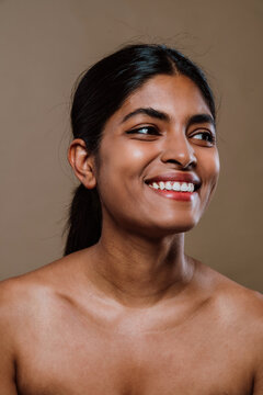 Professional beauty studio portrait on a young indian woman with long dark hair
