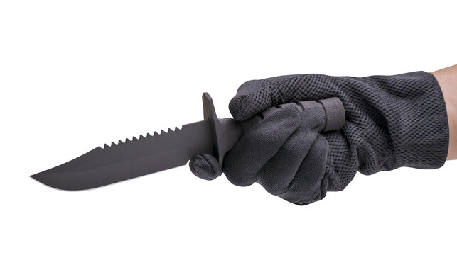 Hand in dark grey glove holding serrated black survival knife