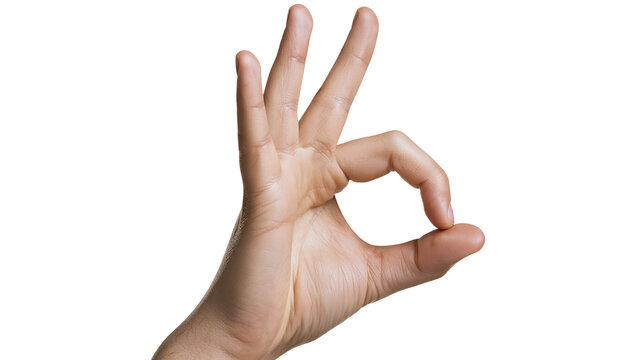 Human hand forming OK gesture with thumb and index finger