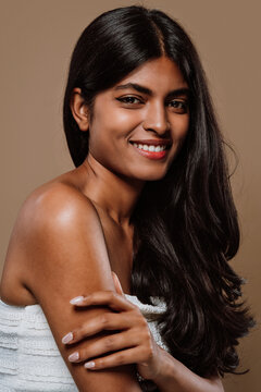 Professional beauty studio portrait on a young indian woman with long dark hair