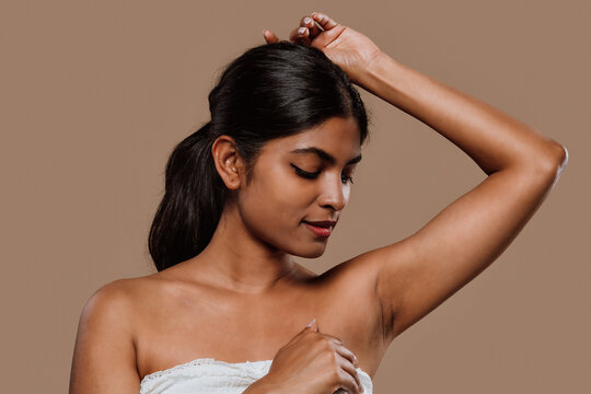 Professional beauty studio portrait on a young indian woman with long dark hair