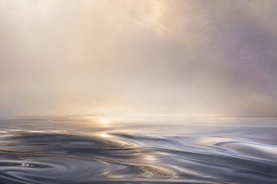 Ethereal abstract landscape with flowing water ripples, dreamy golden sunset sky, soft atmospheric light over calm ocean waves