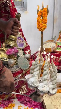4k clip of Shivling or shiv lingam decorated with colours and flowers to worship lord shiv. Selective focus.