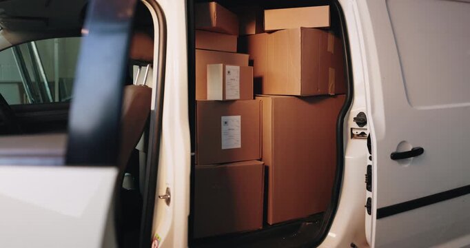 Distribution, delivery and cardboard boxes in empty van for inventory, export or cargo freight. Logistics, parcel and packages in vehicle for supply chain, stock or quality control with order.