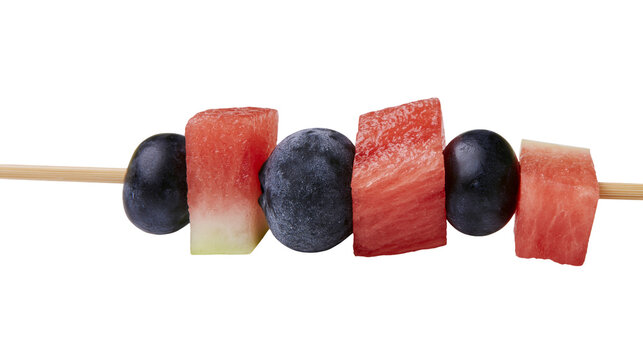 Fresh blueberries and cubed watermelon on a wooden skewer, isolated on transparent background