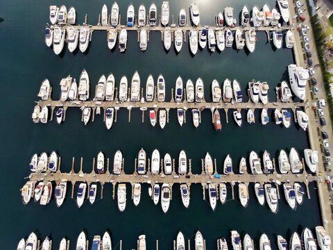 Aerial view of Atakoy marina filled with numerous yachts and boats docked in orderly rows in Istanbul, Turkey.