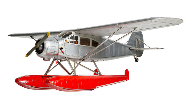 Silver seaplane with red floats and propeller