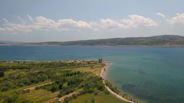 Aerial view of the historic Vecka Kula tower ruins on a pebble beach in Starigrad Paklenica, Croatia