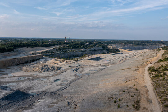 Aerial view of the Kalksteinbruch Rudersdorf limestone quarry featuring expansive excavated terrain, industrial mining paths, and rocky formations in Rudersdorf, Brandenburg, Germany.