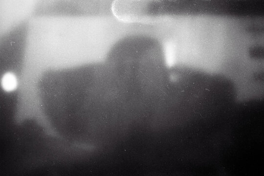 Blank grained film strip texture background with heavy grain, dust and light leak