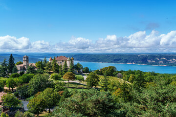 Fototapeta premium Aiguines castle, Chateau d Aiguines with St Croix lake in background, near Verdon gorge, Provence, France