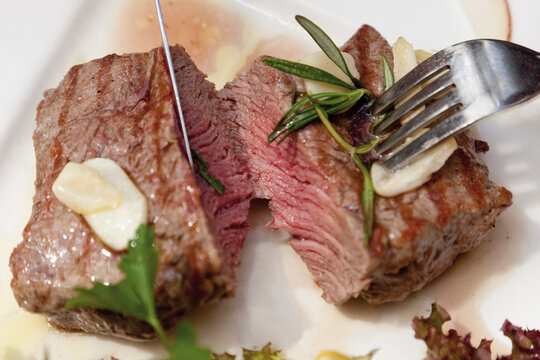 Close up of grilled rump steak with garlic