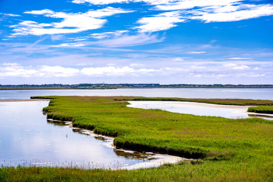 The Rantumbecken nature reserve shows green grass and blue water
