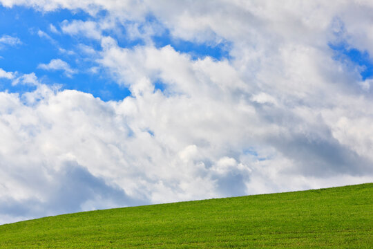 Germany, Bavaria, View of meadow with sky and clouds