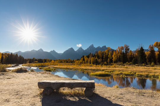 USA, Wyoming, Grand Teton National Park, view to Teton Range with Snake River and bench in the foreground