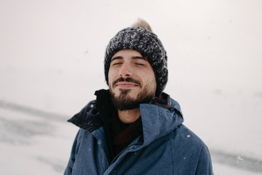 A man enjoys the cold winter weather outdoors in snowy Finland