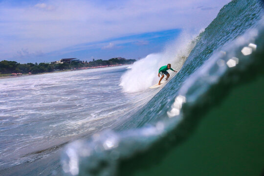 Indonesia, Bali, Surfer in the tube getting barreled