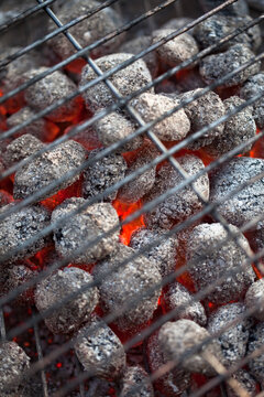 Germany, Burning coal briquettes of barbecue grill, close up