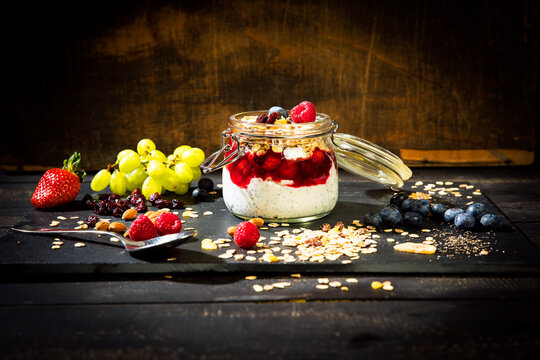 Muesli with Red Fruit Jelly, chia, curd, raspberry, almond, cranberry, blue berry, dried banana, grape