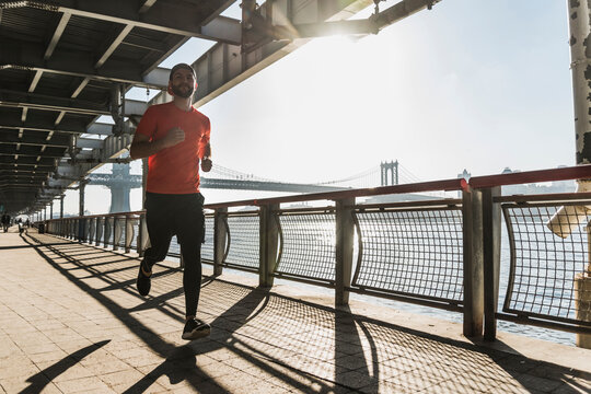 USA, New York City, man running at East River