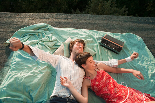 Young couple relaxing on blanket, elevated view