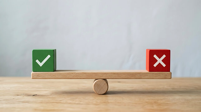 Wooden seesaw balancing a green block with check mark and a red block with x