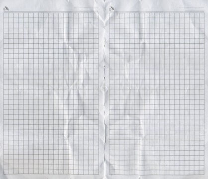 Natural checkered crumpled paper pages. Old squared notebook sheet paper texture.