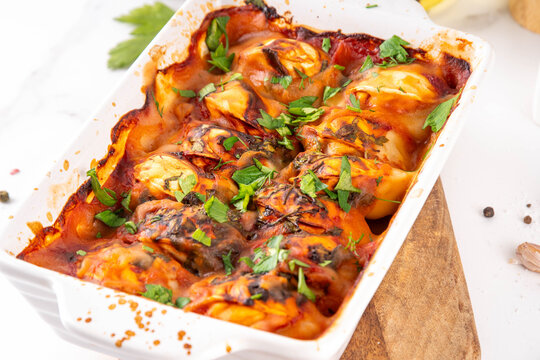 Viral Dump-and-Bake One Pan Dumpling Casserole. Tasty and simple Dumplings Bake Casserole recipe idea, made with frozen dumplings and tasty tomato sauce, fresh herbs and spices