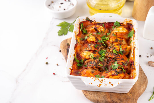 Viral Dump-and-Bake One Pan Dumpling Casserole. Tasty and simple Dumplings Bake Casserole recipe idea, made with frozen dumplings and tasty tomato sauce, fresh herbs and spices