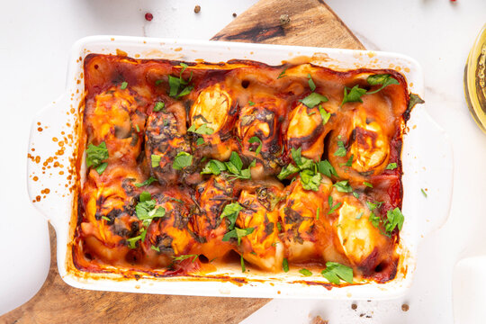 Viral Dump-and-Bake One Pan Dumpling Casserole. Tasty and simple Dumplings Bake Casserole recipe idea, made with frozen dumplings and tasty tomato sauce, fresh herbs and spices