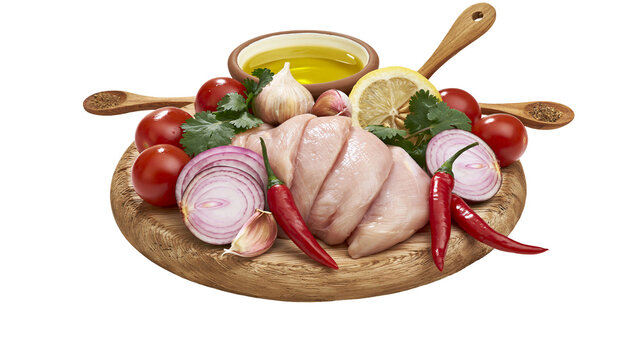 Raw chicken breast with red onion tomatoes garlic chili peppers lemon, and oil