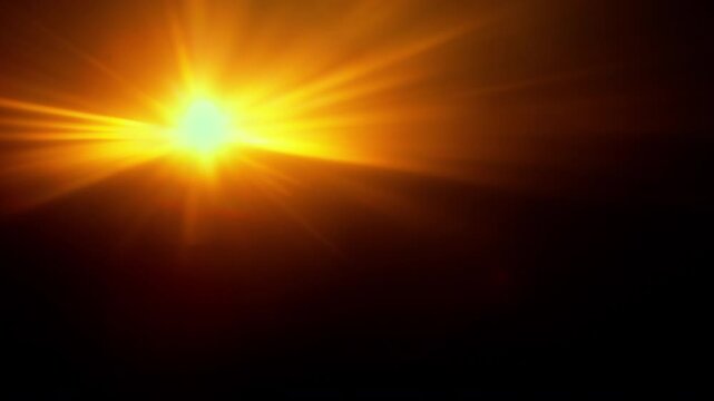 Real Shooted Orange Lens Flare Overlay in Motion Isolated on Black Background in Slow Motion.