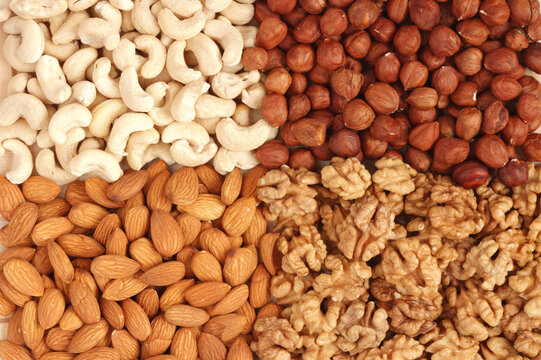 Scene featuring different nuts (almons, cashews, walnuts and filbers) close up