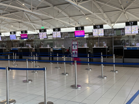Larnaca, Cyprus - June 11, 2025. Airport check-in counters inside the departure terminal before passenger boarding. International airline operations and travel services