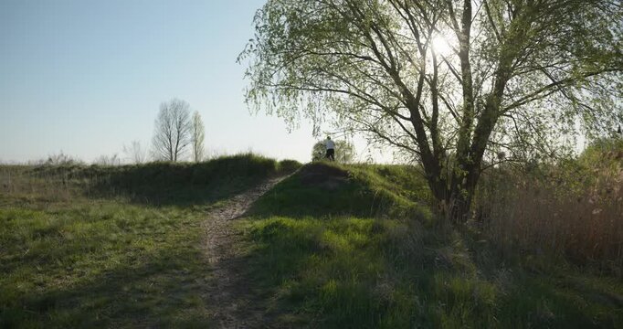 Boy Rides Bicycle Bike on Nature. 4K 10-bit