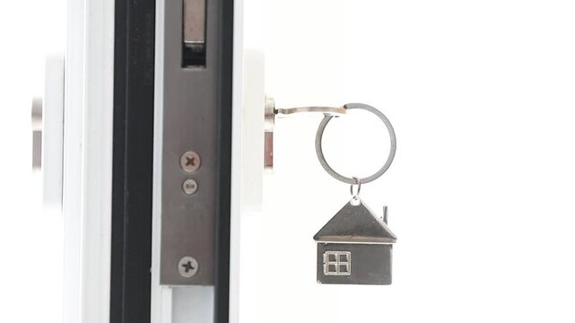 house-shaped keyring on the door lock