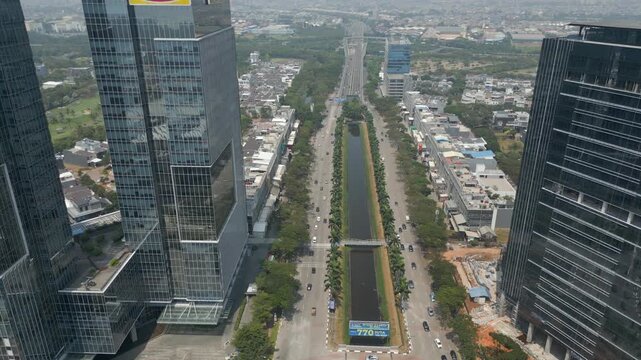 Skyscrapers Roads And Traffic Pantai Indah Kapuk Street Jakarta Indonesia Drone Track Left 4K 60FPS