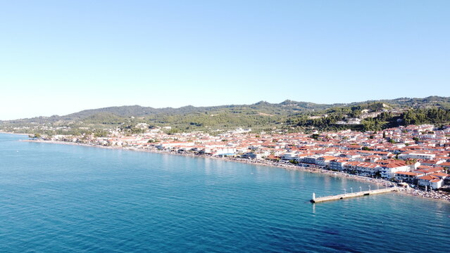 PEFKOHORI, GREECE - JUNE 27, 2026: Aerial view of Pefkohori coastal village with pier and beach in Kassandra Halkidiki