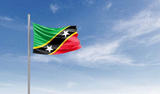 Saint Kitts and Nevis national flag waving in the sky.